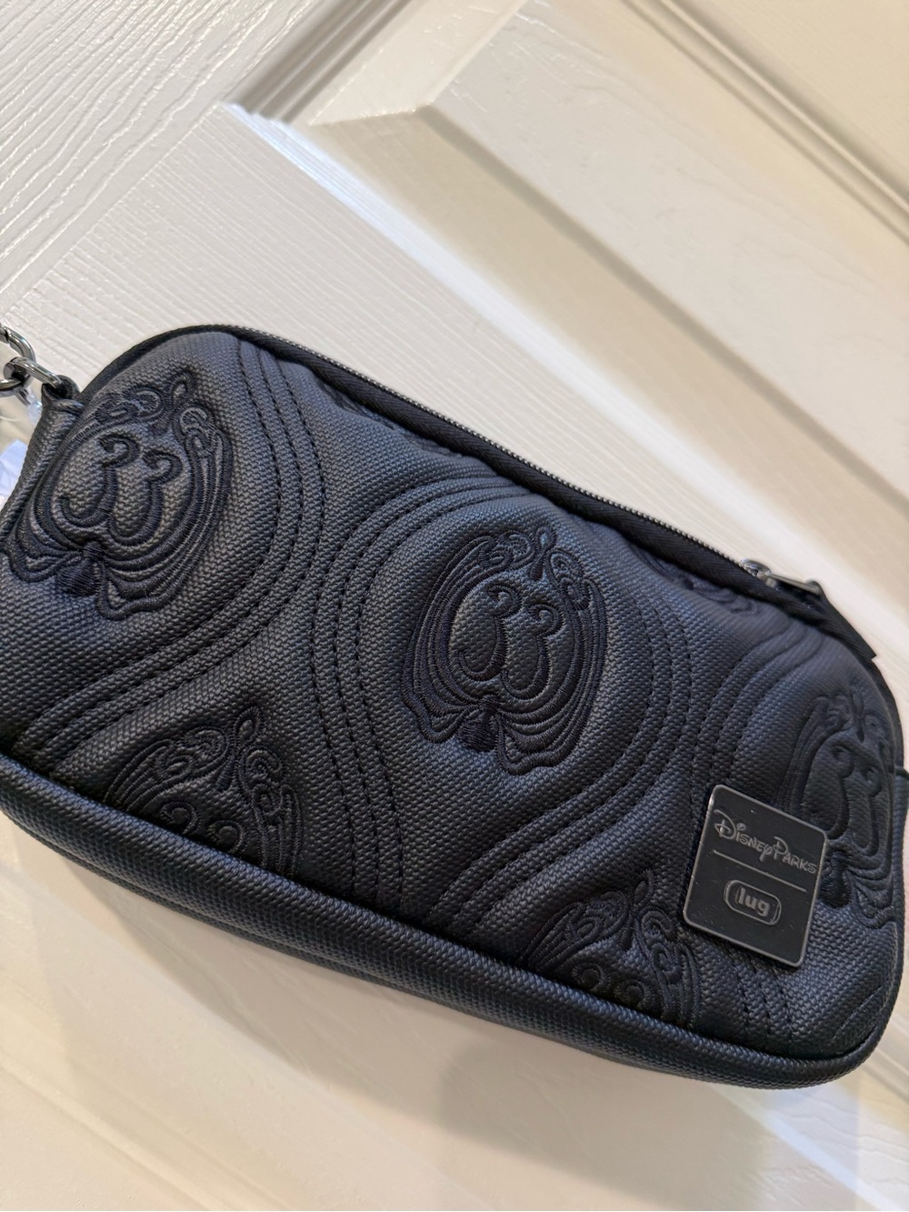 lug Black Quilted Wristlet Clutch with Embossed Motif